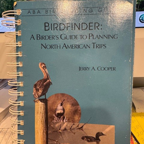 Close-up of David Govatski holding his Birdfinder guidebook.